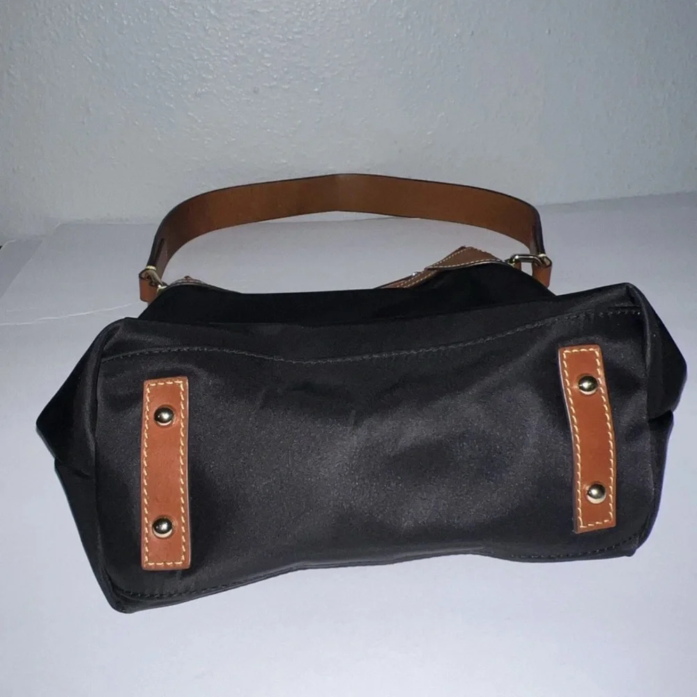 Dooney & Bourke Black Shoulder Bag with Brown Leather Trim and Red Interior